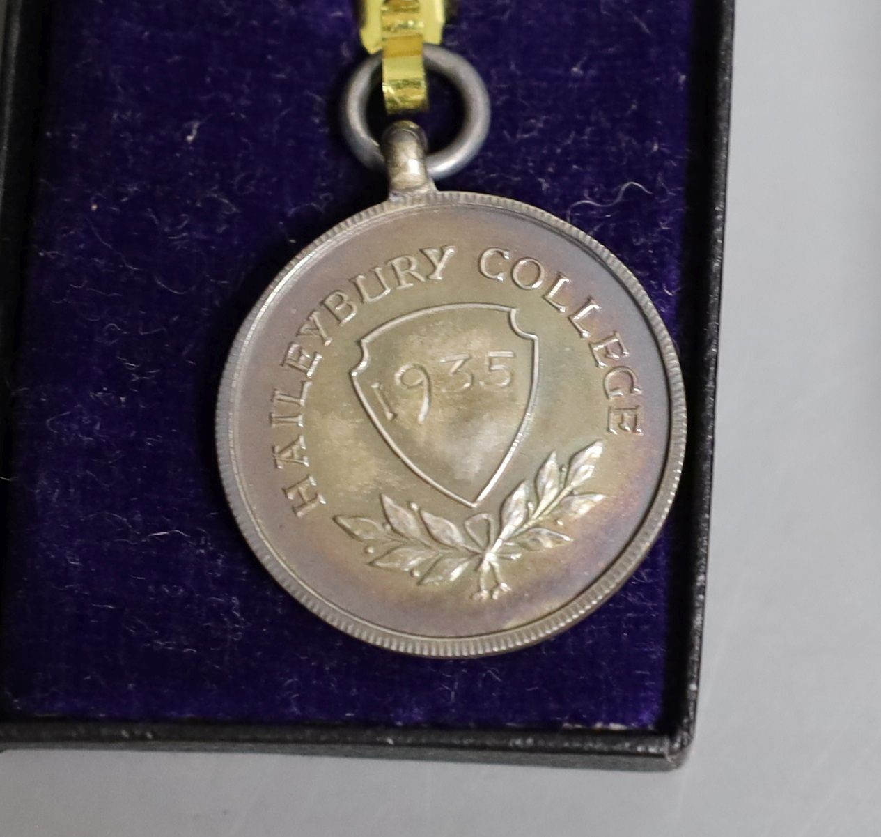 A WWI Queen Mary Christmas box, two National reserve London enamelled badges and two college medals to G. Lovegrove
